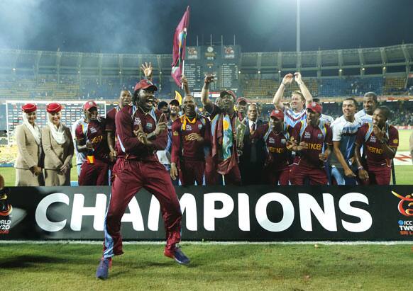 West Indies' cricketer Chris Gayle, left front, dances along with his team mates to celebrate their win over Sri Lanka in the ICC Twenty20 Cricket World Cup final match in Colombo.