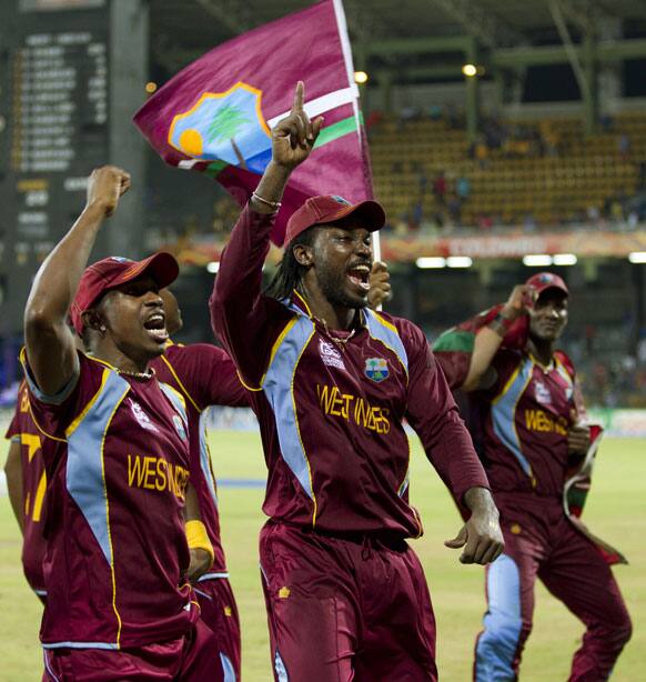 West Indies's Chris Gayle, center, and others celebrate after West Indies beat Sri Lanka to win the ICC Twenty20 Cricket World Cup in Colombo.