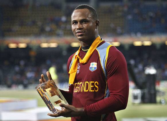 West Indies' cricketer Marlon Samuels poses with his Man of the Match award after his team's win over Sri Lanka in the ICC Twenty20 Cricket World Cup final match.