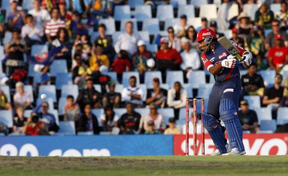 Delhi Daredevils's captain Mahela Jayawardene, watches his shot off Kolkata Knight Riders's bowler Brett Lee, unseen, during the Champions League Twenty20 cricket match at the Centurion Park in Pretoria.