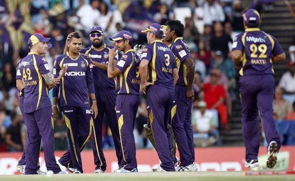 Kolkata Knight Riders's bowler Sunil Narine, second from left, celebrates with teammates after dismissing Delhi Daredevils's captain Mahela Jayawardene, unseen, for 21 runs during the Champions League Twenty20 cricket match at the Centurion Park in Pretoria.