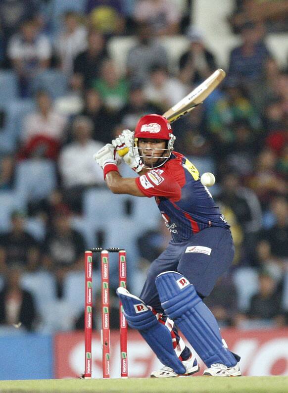 Delhi Daredevils's batsman Unmukt Chand plays a shot off Kolkata Knight Riders's bowler bowler Pradeep Sangwan, unseen, during the Champions League Twenty20 cricket match at the Centurion Park in Pretoria, South Africa.