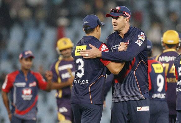 Delhi Daredevils's Kevin Pietersen, right, celebrates with teammate Ross Taylor, left, at the end of play of the Champions League Twenty20 cricket match at the Centurion Park in Pretoria, South Africa.