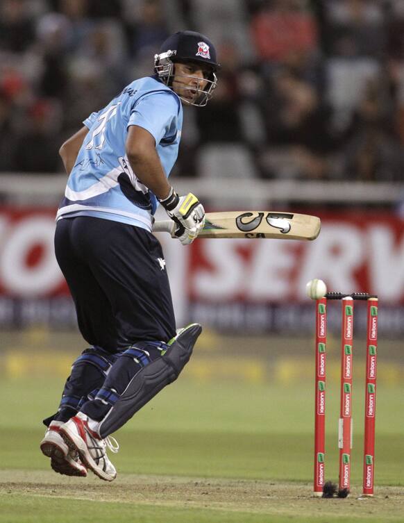 Auckland Aces Azhar Mahmood looks back as he played a shot during the Champions League Twenty20 cricket game against Kolkata Knight Riders in Cape Town.