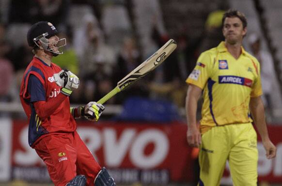 Highveld Lions Chris Morris, left, reacts as his team wins the game against the Chennai Super Kings, during a Champions League Twenty20 in Cape Town, South Africa.