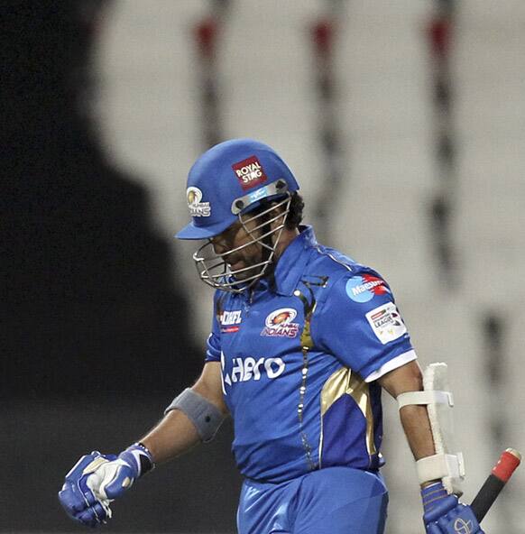 Mumbai Indians batsman Sachin Tendulkar leaves the field after dismissed by Chennai Supper Kings's bowler Ben Hilfenhaus, unseen, for 2 runs during their Champions League Twenty20 cricket match.