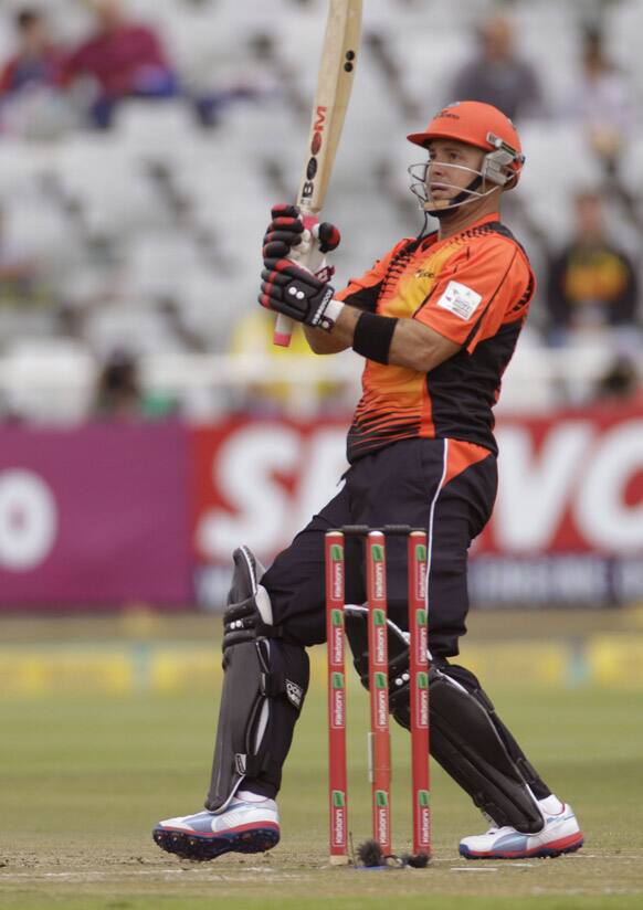 Perth Scorchers Herschelle Gibbs hits a shot during a game against the Delhi Daredevils during a Champions League Twenty20 cricket game in Cape Town, South Africa.