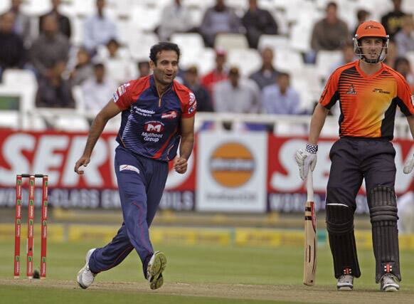 Perth Scorchers Shaun Marsh, right, looks on as Delhi Daredevils Irfan Pathan, left, react as he waits for the ball during a Champions League Twenty20 game in Cape Town, South Africa.