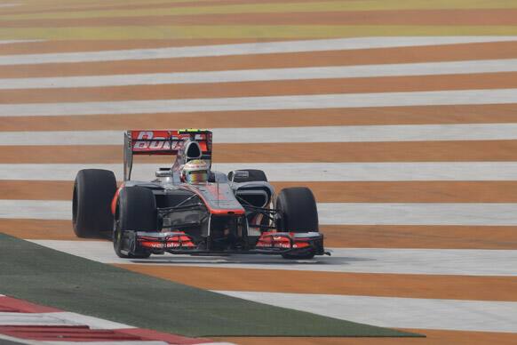 McLaren driver Lewis Hamilton of Britain goes wide during the first practice session for the Indian Formula One Grand Prix at the Buddh International Circuit in Noida.