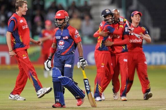 Pawan Negi of Delhi Daredevils, foreground, leaves the field during their Twenty20 semifinal against the Highveld Lions in Durban.