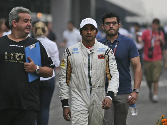 Hispania Racing Team driver Narain Karthikeyan of India walks to the drivers meeting after the second practice session for the Indian Formula One Grand Prix, at the Buddh International Circuit in Noida, on the outskirts of New Delhi.