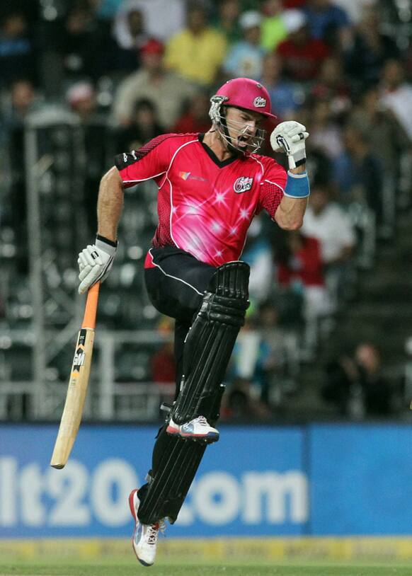 Sydney Sixers's batsman Michael Lumb celebrates after scoring winning runs during the final of their Champions League Twenty20 cricket match at the Wanderers Stadium in Johannesburg, South Africa.