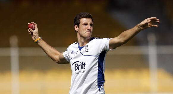 England's cricketer Steven Finn throws a ball during a practice session in Ahmadabad.