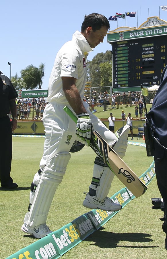 Australia's Ricky Ponting waves to fans as he walks off the pitch for the last time after his wicket fell for 8 runs on day four of the third cricket test match against South Africa in Perth.