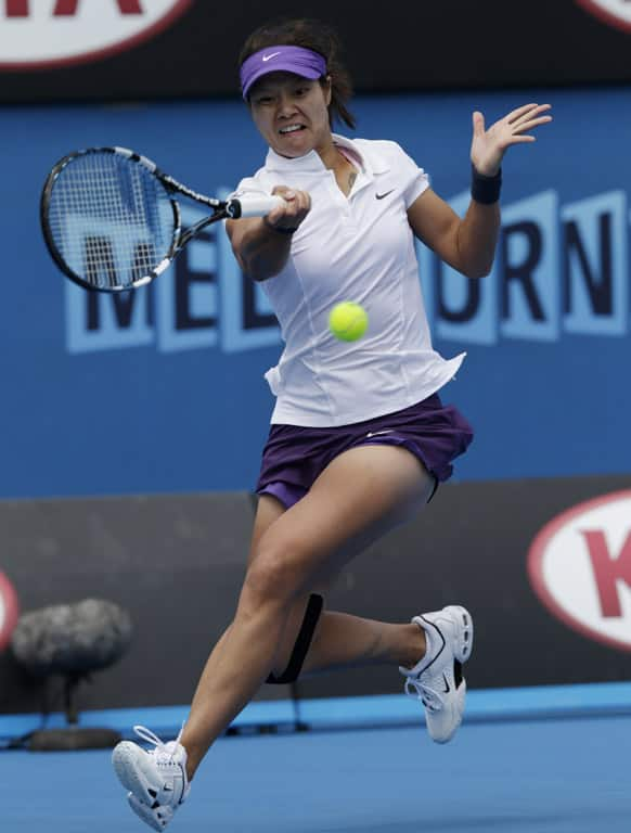 China's Li Na makes a forehand return to Kazakstan's Sesil Karatantcheva during their first round match at the Australian Open tennis championship in Melbourne.