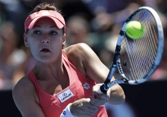 Poland's Agnieszka Radwanska hits a backhand return to Australia's Bojana Bobusic during their first round match at the Australian Open tennis championship in Melbourne.