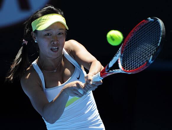 Taiwan's Chang Kai-Chen makes a forehand return to Australia's Samantha Stosur during their first round match at the Australian Open tennis championship in Melbourne.