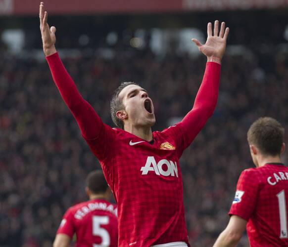 Manchester United's Robin van Persie celebrates after scoring against Liverpool during their English Premier League soccer match at Old Trafford Stadium, Manchester, England, Sunday Jan. 13, 2013.