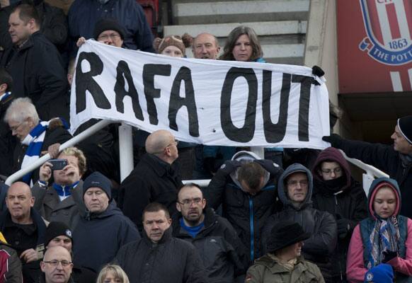 Chelsea supporters hold up a banner against their manager Rafa Benitez before their English Premier League soccer match against Stoke at the Britannia Stadium, Stoke, England, Saturday Jan. 12, 2013.