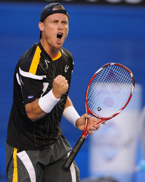 Australia's Lleyton Hewitt reacts during his first round match against Serbia's Janko Tipsarevic at the Australian Open tennis championship in Melbourne.