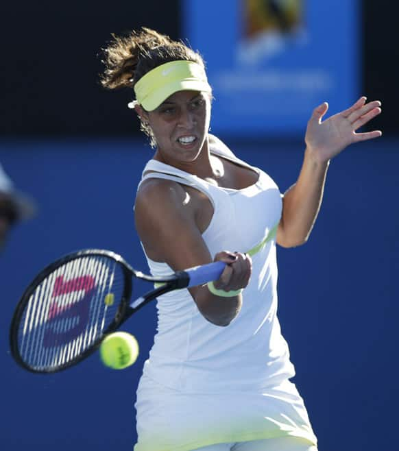 Madison Keys, of the United States, serves during her first round match against Australia's Casey Dellacqua at the Australian Open tennis championship in Melbourne.