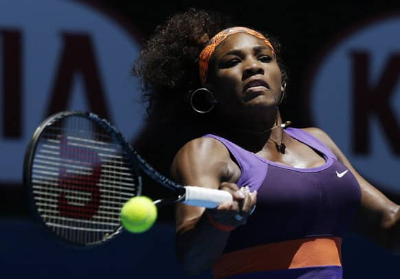 Serena Williams of the US hits a forehand return to Romania's Edina Gallovits-Hall during their first round match at the Australian Open tennis championship.