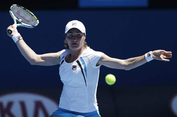 Romania's Monica Niculescu makes forehand return to Victoria Azarenka of Belarus during their first round match at the Australian Open tennis championship.