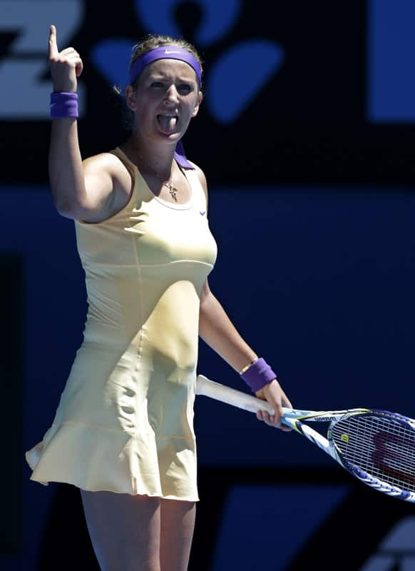 Victoria Azarenka of Belarus celebrates after defeating Romania's Monica Niculescu in their first round match at the Australian Open tennis championship.