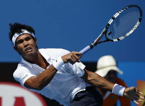 India's Somdev Devvarman hits a forehand return to Poland's Jerzy Janowicz during their second round match at the Australian Open tennis championship.