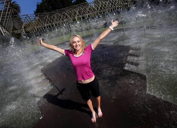 Russian player Elina Vesnina poses for photos in a fountain in Melbourne.