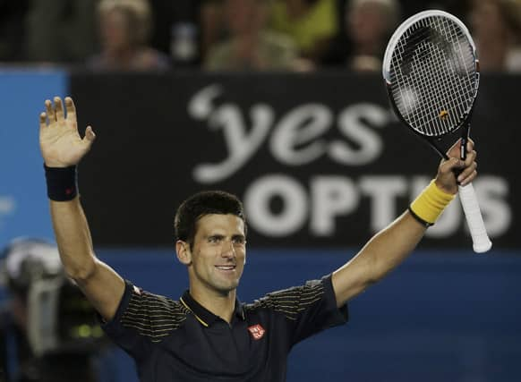 Serbia's Novak Djokovic celebrates after defeating Ryan Harrison of the US in their second round match at the Australian Open tennis championship in Melbourne.