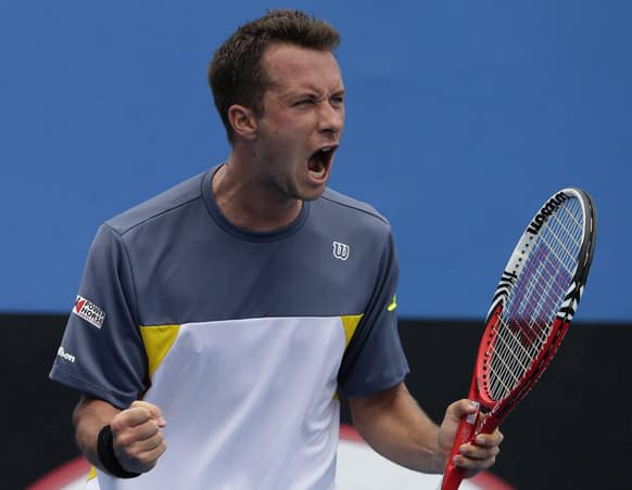 Germany's Philipp Kohlschreiber celebrates after defeating Israel's Amir Weintraub in their second round match at the Australian Open tennis championship.