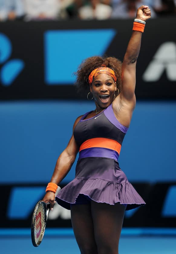 Serena Williams of the US celebrates after defeating Spain's Garbine Muguruza in their second round match at the Australian Open tennis championship.