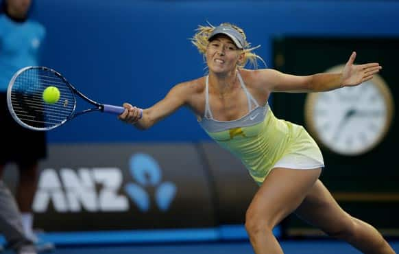 Russia's Maria Sharapova makes a forehand return to Venus Williams of the US during their third round match at the Australian Open tennis championship in Melbourne.