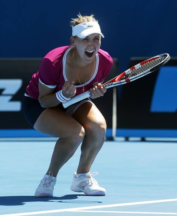 Russia's Elena Vesnina reacts after taking match point to win her third round match against Italy's Roberta Vinci at the Australian Open tennis championship in Melbourne.