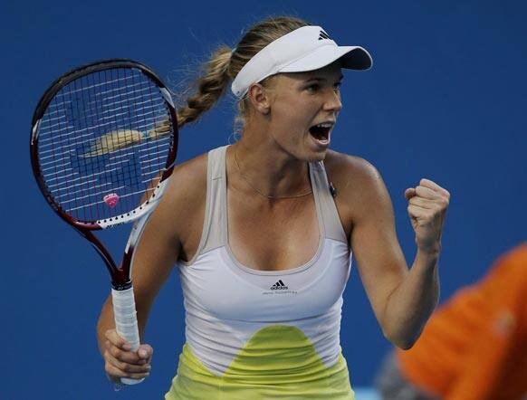 Denmark's Caroline Wozniacki celebrates her third round win over Ukraine's Lesia Tsurenko at the Australian Open tennis championship in Melbourne.