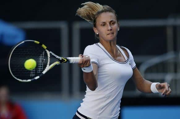 Ukraine's Lesia Tsurenko hits a return to Denmark's Caroline Wozniacki during their third round match at the Australian Open tennis championship in Melbourne.