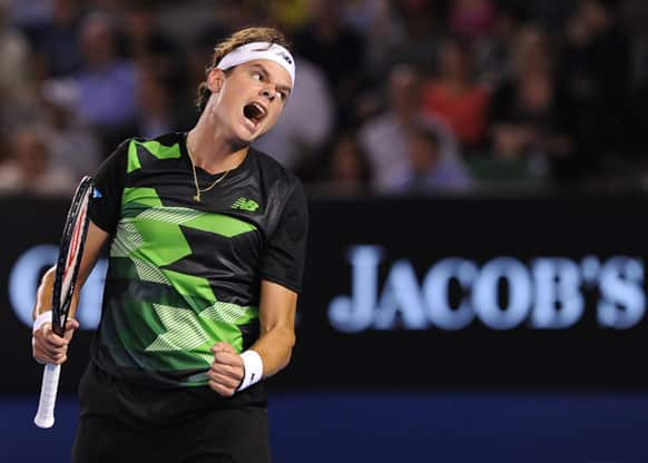 Canada's Milos Raonic reacts during his fourth round loss to Switzerland's Roger Federer at the Australian Open tennis championship.