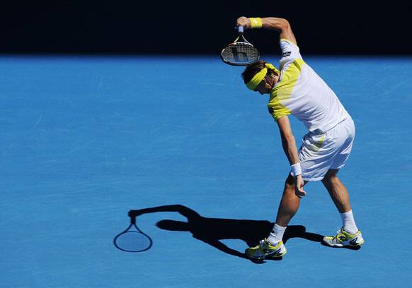 Spain's David Ferrer swings his racket in frustration during his quarterfinal match against compatriot Spain's Nicolas Almagro at the Australian Open tennis championship.