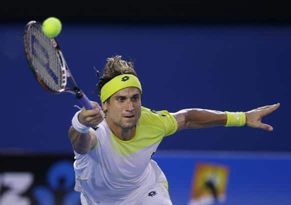 Spain's David Ferrer reaches for a return to Serbia's Novak Djokovic during their semifinal match at the Australian Open tennis championship in Melbourne, Australia.