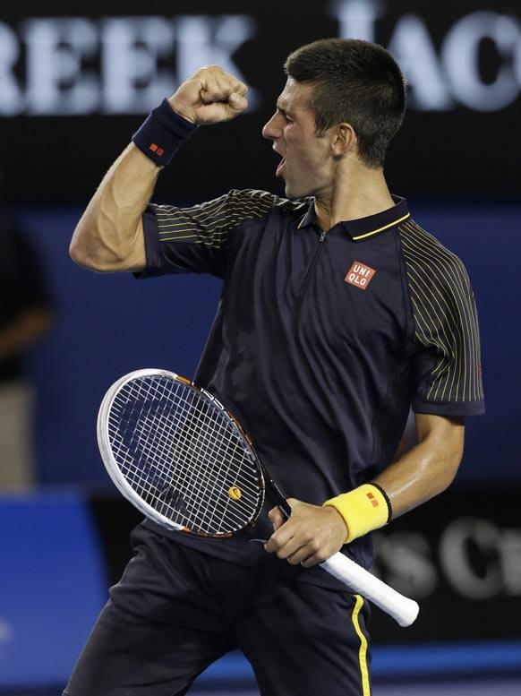 Serbia's Novak Djokovic celebrates after defeating Spain's David Ferrer in their semifinal match at the Australian Open tennis championship in Melbourne, Australia.