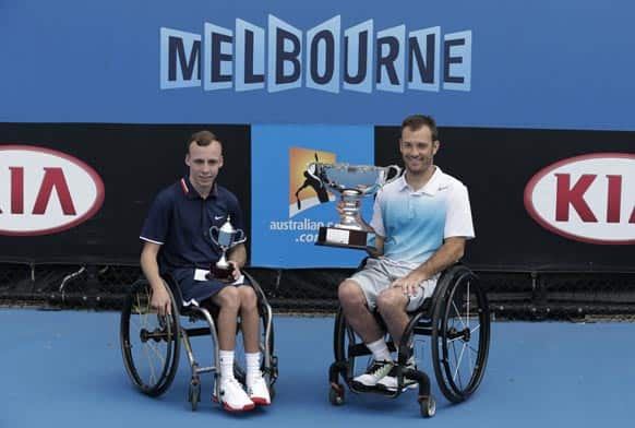 David Wagner,right, of the US holds his trophy after defeating Britain's Andrew Lapthorne, left, in the quad wheelchair singles final at the Australian Open tennis championship in Melbourne.