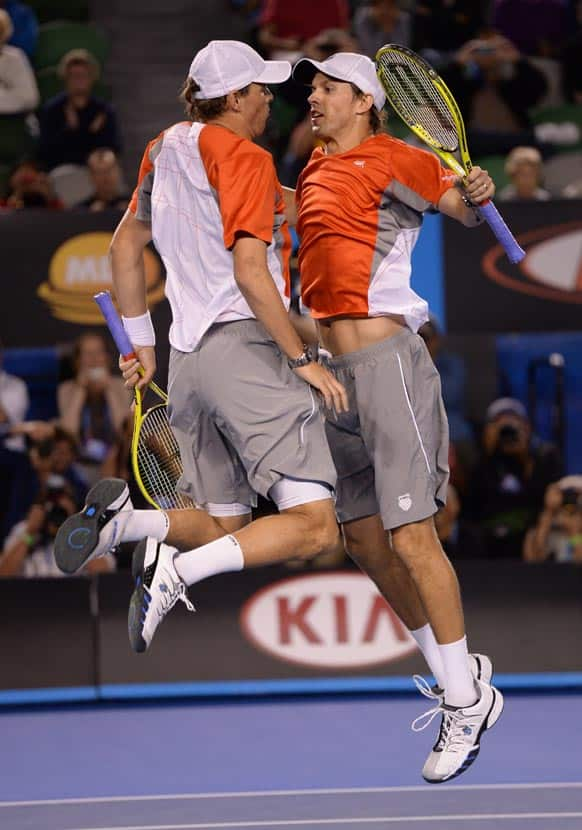 Bob and Mike Bryan of the US celebrate after defeating RobinHaase and Igor Sijsling of the Netherlands in the men's doubles final at the Australian Open tennis championship in Melbourne.