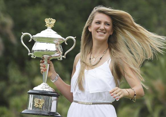 Victoria Azarenka of Belarus poses with the Australian Open trophy in the Royal Botanical Gardens following her win over China's Li Na in the women's final, in Melbourne.