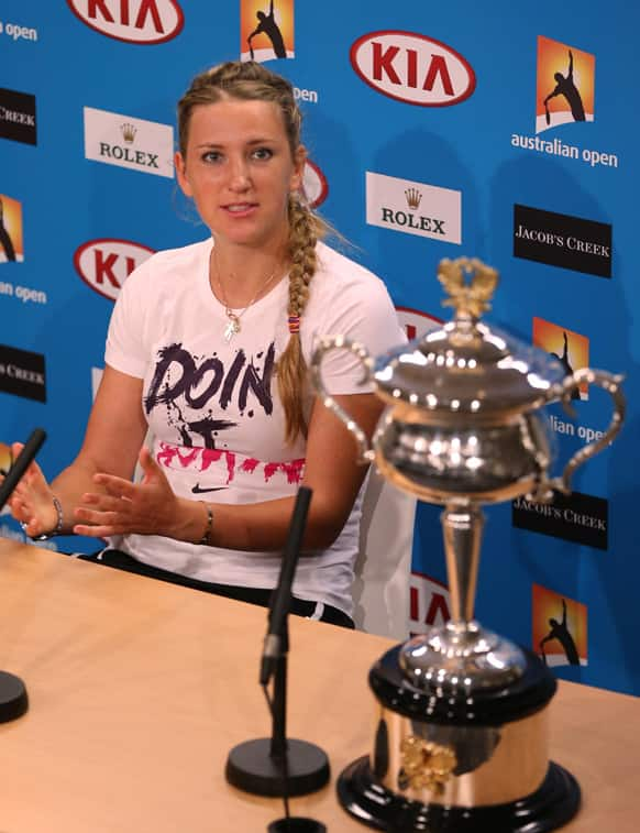 Victoria Azarenka of Belarus speaks next to her trophy in a press conference after she defeated China's Li Na in the women's final at the Australian Open tennis championship in Melbourne.