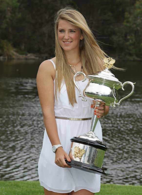 Victoria Azarenka of Belarus poses with the Australian Open trophy in the Royal Botanical Gardens following her win over China's Li Na in the women's final in Melbourne.