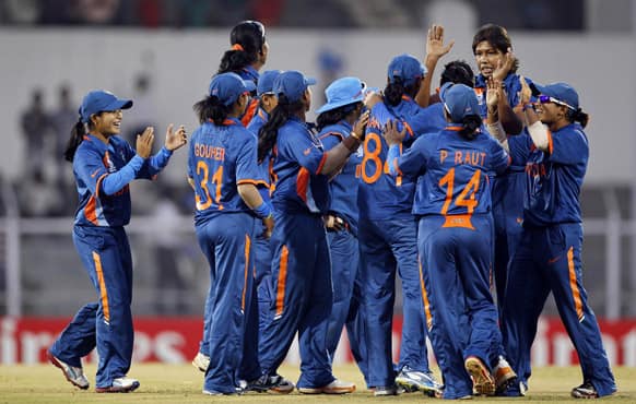 Indian cricketers celebrate the dismissal of West Indies' Kycia Knight during the opening match of the ICC Women's World Cup in Mumbai.