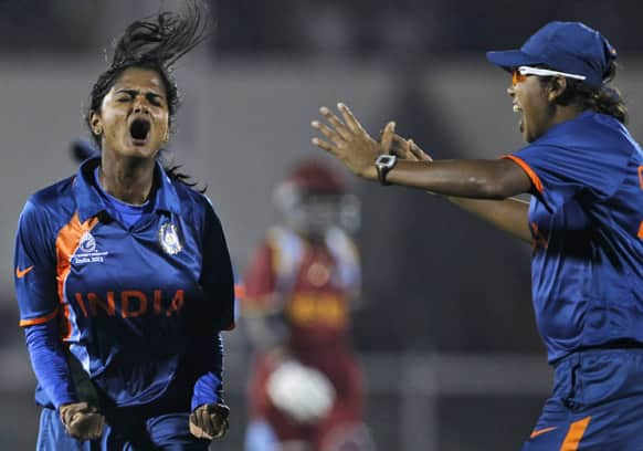 Indian cricketer Niranjan Nagarajan celebrates the dismissal of West Indies' Deandra Dottin during the opening match of the ICC Women's World Cup cricket in Mumbai.