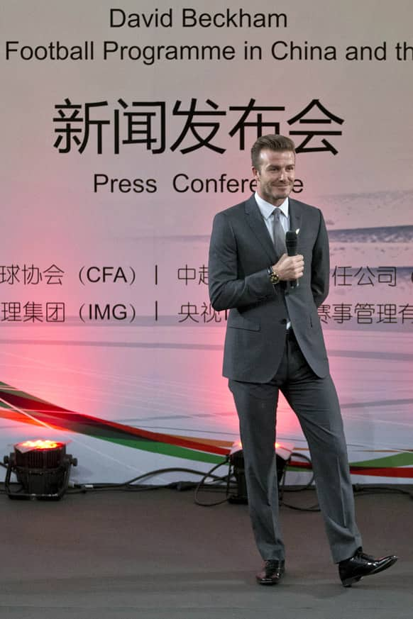 David Beckham speaks during an event to promote soccer games and Chinese soccer league at Shijia Primary School in Beijing.