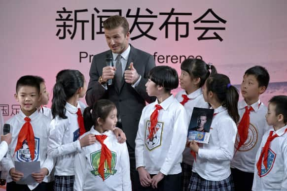 David Beckham speaks during a promotional event at Shijia Primary School in Beijing .